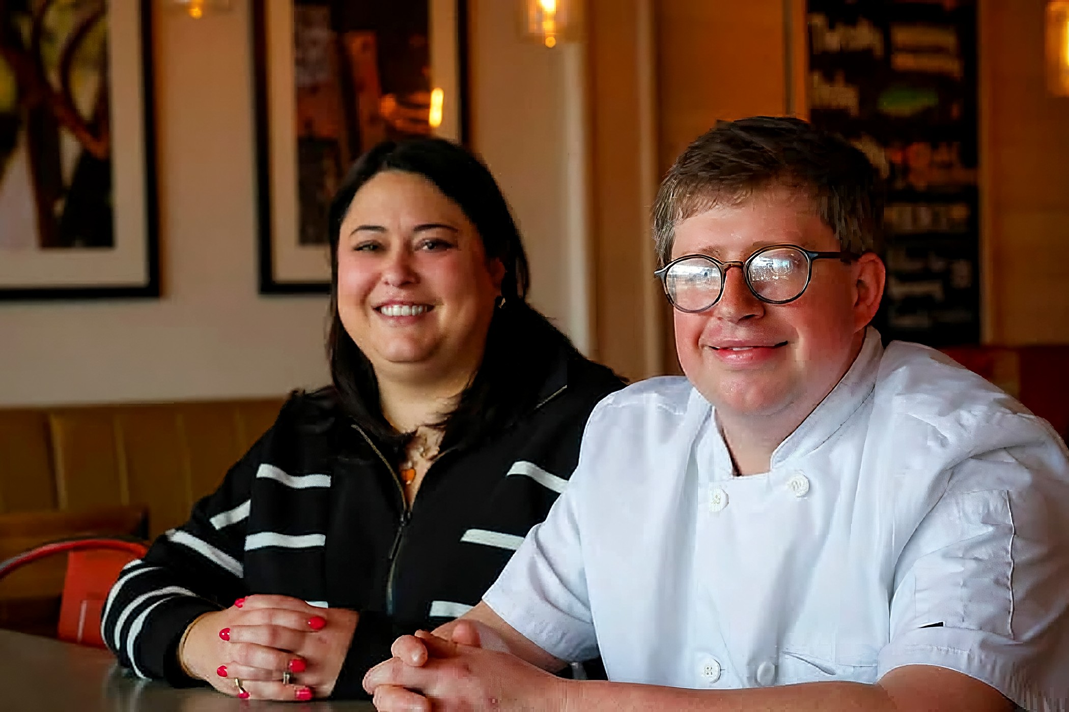 Scott and Wesley Ailsworth seated together in the dining room at Lou Lou's